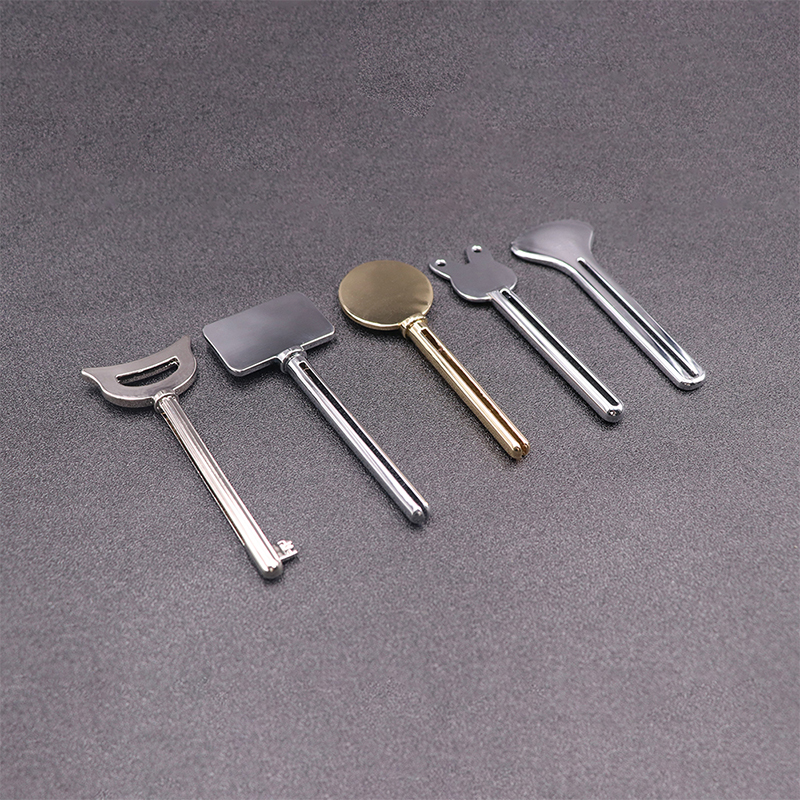 Metal Tandkräm Dispenser Ansiktsrengöring Tandkräm Tube Squeezer Nyckelform Kosmetika Tube Squeezer