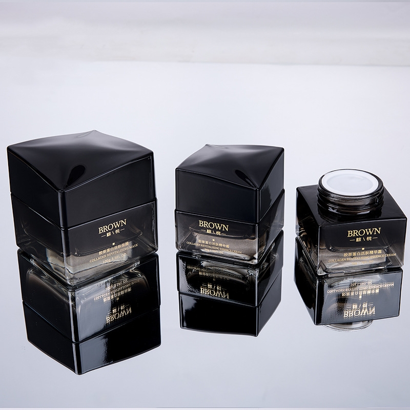 Unik fyrkantig krämburk i glas med höjt lockdesign för kosmetiska förpackningar Unik fyrkantig krämburk i glas med höjt lockdesign för kosmetiska förpackningar
